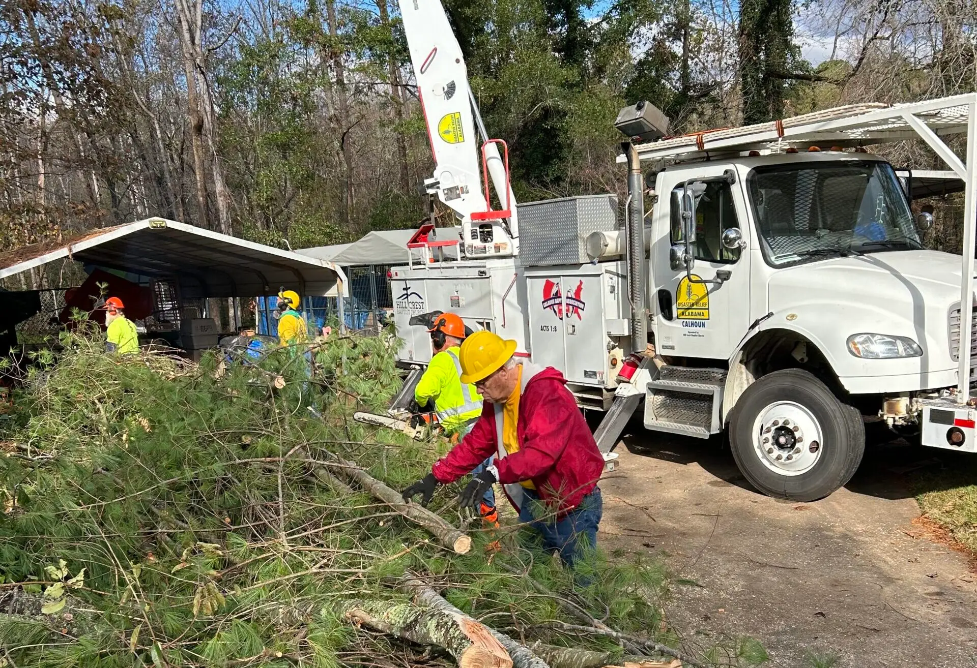 A team from Calhoun Baptist Association works to clear trees for a homeowner in western North Carolina.