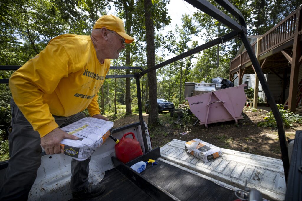 Roger Bailey, a member of FBC Athens, moves concrete mix at a disaster relief job site in North Carolina.