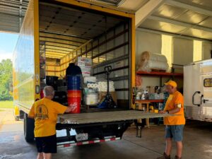 Volunteers load the Alabama Baptist Disaster Relief mass feeding unit’s box truck with supplies.